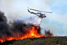 اطفای حریق جنگلهای توسکستان با تلاش بالگرد هلال احمر (فیلم)